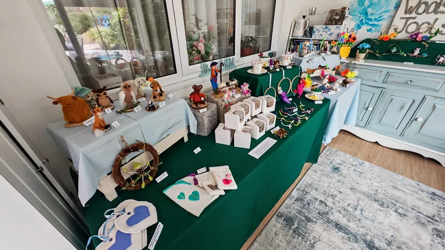 My stall laid out with felted animals, fairy hoops, teacups and flowers under the Wools by Jools sign
