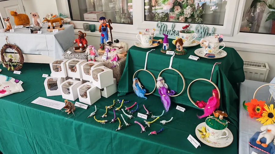 Felted animals, Farmer Fred and his sheep, boxed hedgehog air fresheners and dragonfly pins on the stall
