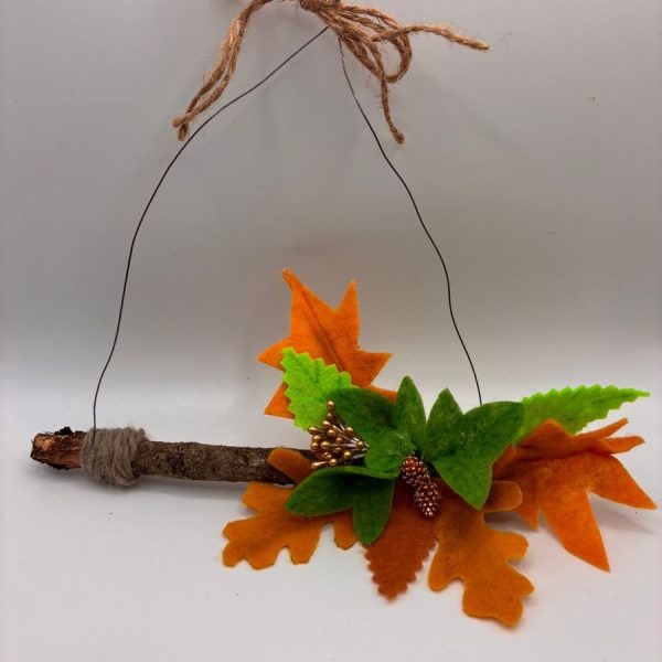 Autumn leaves and berries on hanging twig