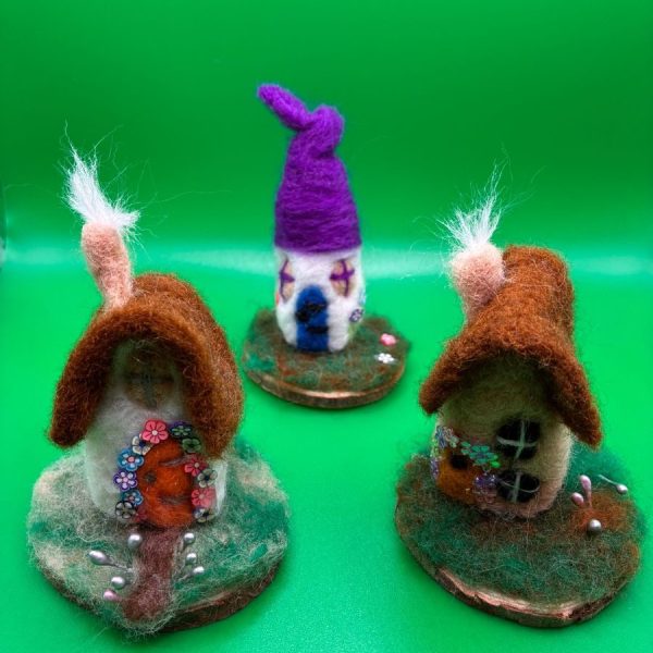 Fairy cottages on mossy wood bases