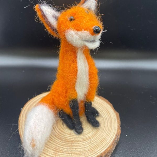 Fox on natural wood slice