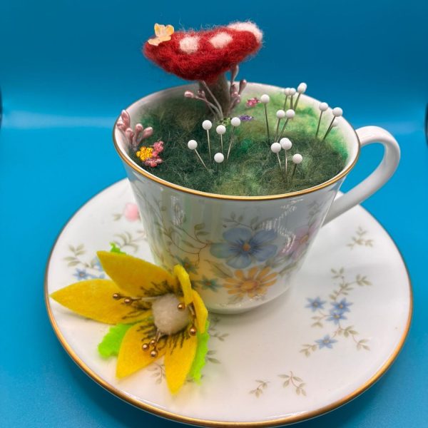 Pin cushion teacup with toadstool scene