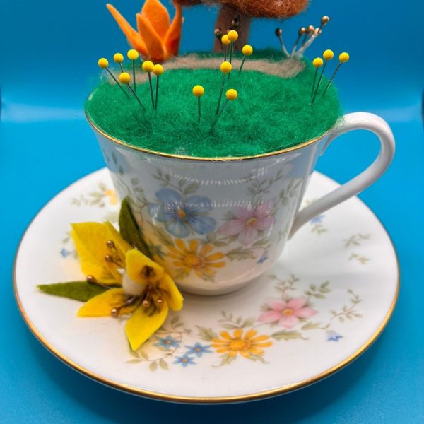 Pin cushion teacup with tree and butterfly scene