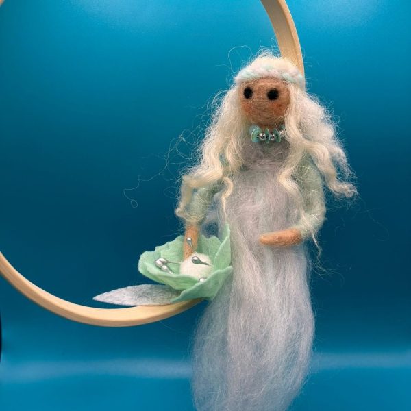 White fairy on wooden hoop